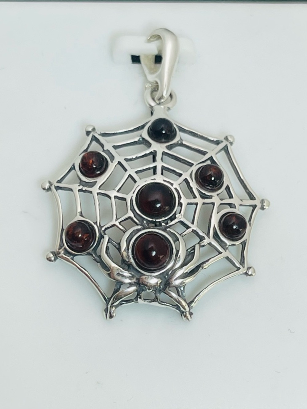 Sterling silver cherry amber spider with web pendant